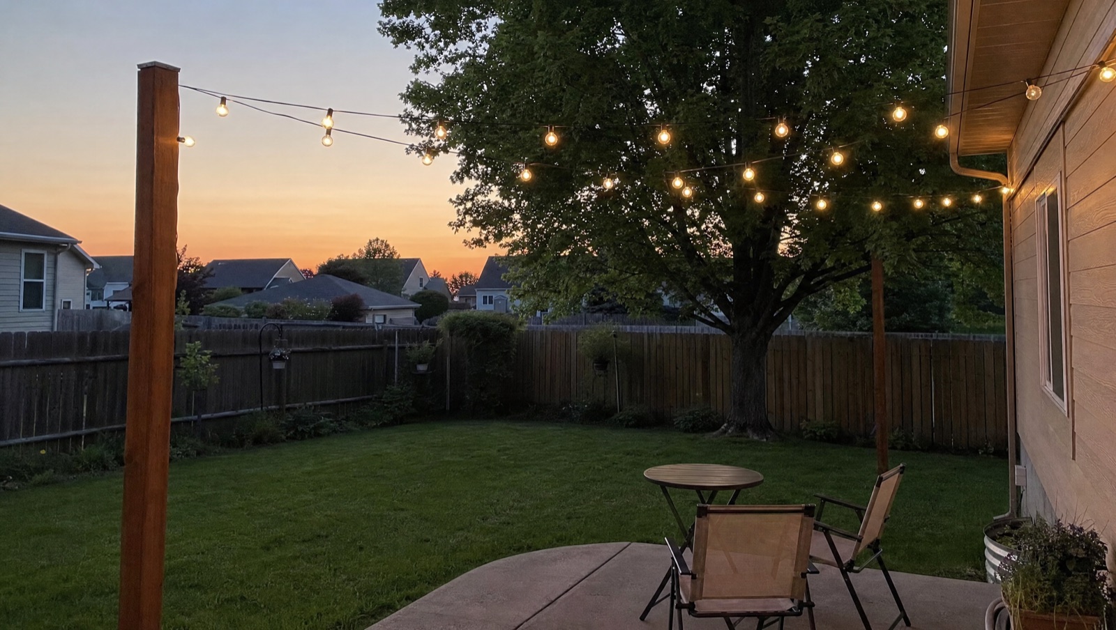 Our empty backyard at dusk, seen through the back door.