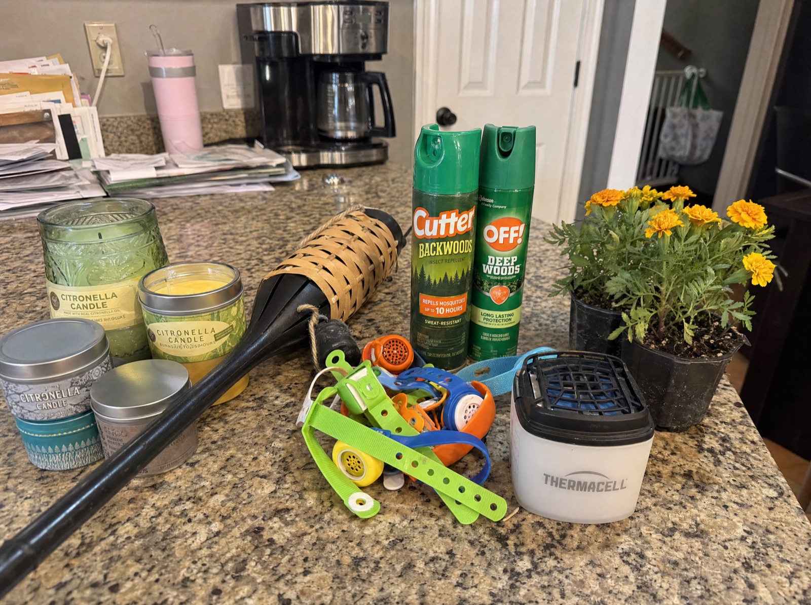 A kitchen counter covered in mosquito products that didn't work.